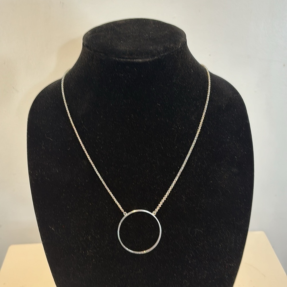 Lele Sadoughi minimalist, silver tone delicate circle necklace.